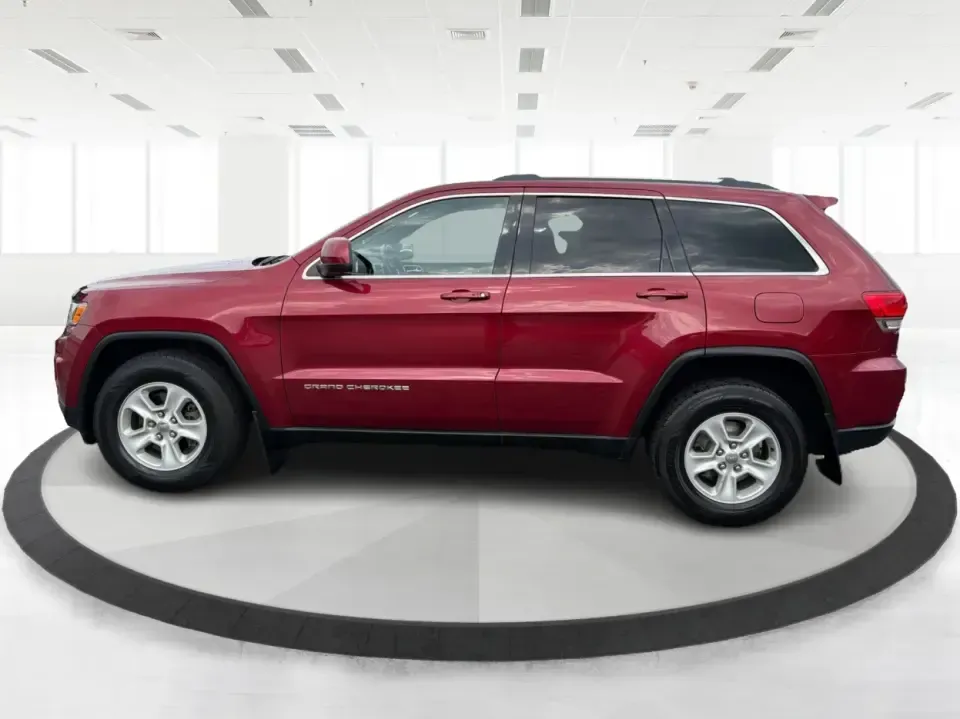 2014 Jeep Grand Cherokee Laredo 4WD (1C4RJFAG9EC) with an 3.6L V6 DOHC 24V engine, 5-Speed Automatic transmission, located at 1099 N County Rd 25A , Troy, OH, 45373, (937) 908-9800, 40.057079, -84.212883 - Picture your next Ohio weekend: the kids and gear loaded up, a cooler in the back, and you cruising out of Troy toward Charleston Falls Preserve or a fall drive through the Miami County countryside-confident that changing weather and back roads won't change your plans. This 2014 Jeep Grand Cherokee- Photo#5