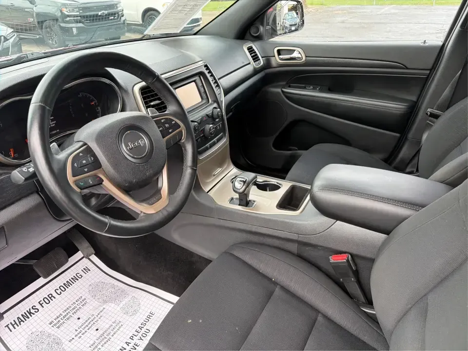 2014 Jeep Grand Cherokee Laredo 4WD (1C4RJFAG9EC) with an 3.6L V6 DOHC 24V engine, 5-Speed Automatic transmission, located at 1099 N County Rd 25A , Troy, OH, 45373, (937) 908-9800, 40.057079, -84.212883 - Picture your next Ohio weekend: the kids and gear loaded up, a cooler in the back, and you cruising out of Troy toward Charleston Falls Preserve or a fall drive through the Miami County countryside-confident that changing weather and back roads won't change your plans. This 2014 Jeep Grand Cherokee- Photo#9