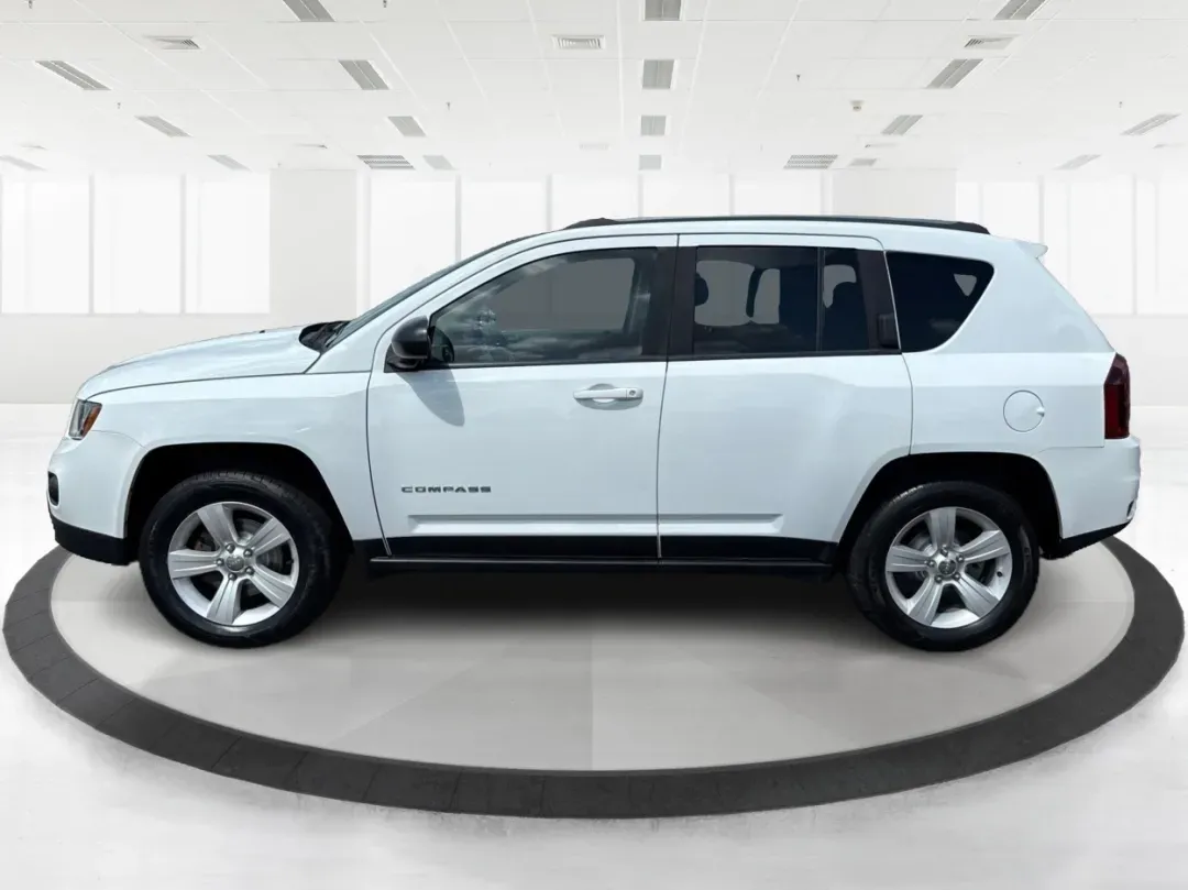 2014 Jeep Compass Sport (1C4NJDBB4ED) with an 2.4L I-4 DOHC engine, located at 1230 East Main St, Xenia, OH, 45385, (937) 908-9800, 39.688026, -83.910172 - 2014 Jeep Compass Sport - Photo#5