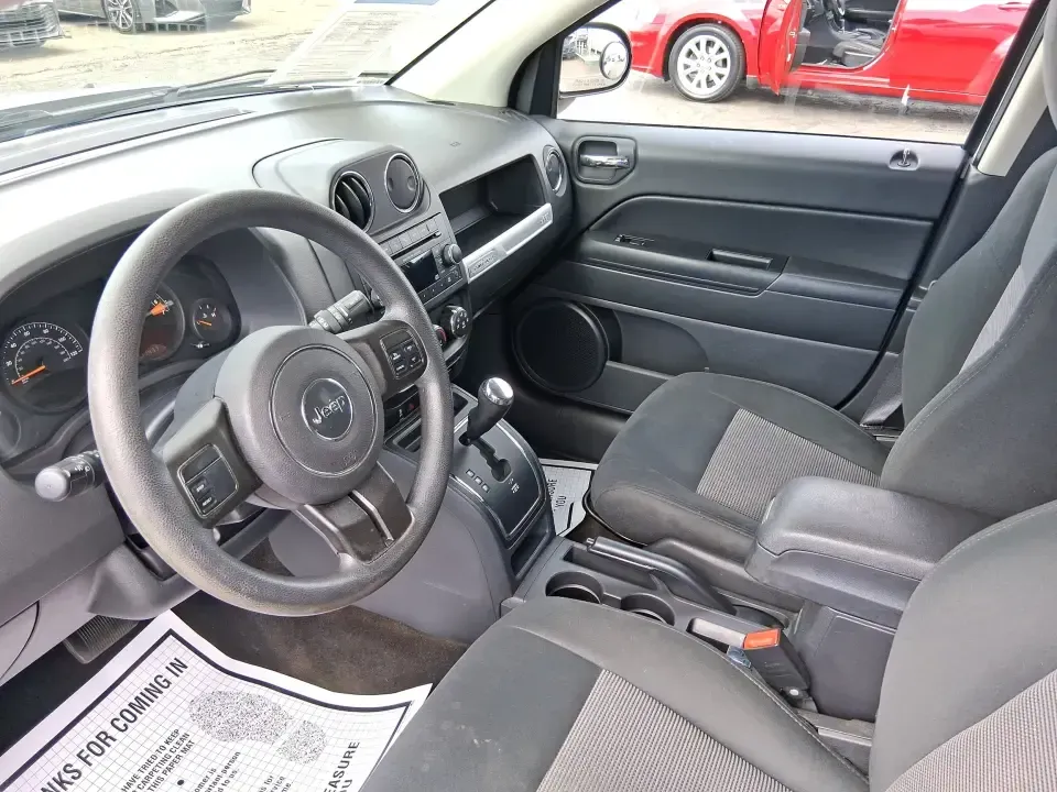 2014 Jeep Compass Sport (1C4NJDBB4ED) with an 2.4L I-4 DOHC engine, Automatic transmission, located at 4508 South Dixie Dr, Moraine, OH, 45439, (937) 908-9800, 39.689976, -84.218452 - **Experience Adventure with the 2014 Jeep Compass Sport at Advantage Car and Credit Xenia!** <br /> <br /> Are you ready to embrace the open road with a vehicle that combines comfort, capability, and style? The 2014 Jeep Compass Sport, available at Advantage Car and Credit in Xenia, Ohio, is the pe - Photo#9
