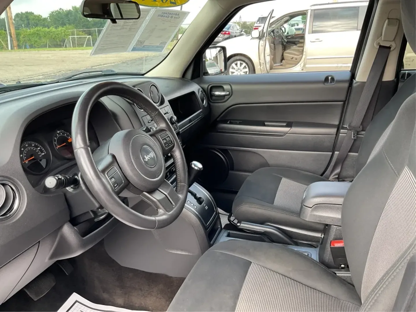 2014 Jeep Patriot Latitude (1C4NJPFA4ED) with an Other engine, located at 1099 N County Rd 25A , Troy, OH, 45373, (937) 908-9800, 40.057079, -84.212883 - **Adventure Awaits with This 2014 Jeep Patriot Latitude at Advantage Car and Credit - Moraine!**<br /> <br /> Are you ready to embark on new adventures, whether it's a weekend getaway, a family road trip, or daily commutes? This 2014 Jeep Patriot Latitude is your perfect companion for all these scen - Photo#9