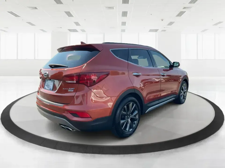 2017 Hyundai Santa Fe 2.0T Ultimate (5XYZW4LA5HG) with an Theta II 2L I-4 gasoline direct injection engine, 6A transmission, located at 880 E. National Road, Vandalia, OH, 45377, (937) 908-9800, 39.891918, -84.183594 - Are you ready to elevate your family adventures or commute comfortably while tackling any road with confidence? Look no further than this 2017 Hyundai Santa Fe 2.0T Ultimate, available now at Advantage Car and Credit in Fairborn, OH. This SUV is not just a vehicle; it's your ticket to creating unfor - Photo#2